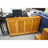 A MODERN STAINED HARDWOOD FOUR DOOR SIDEBOARD