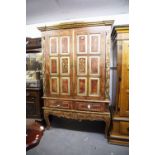 A LARGE RED AND GILT DECORATED CONTINENTAL CABINET ON STAND, WITH DRAGON MOTIF TO EACH DOOR AND