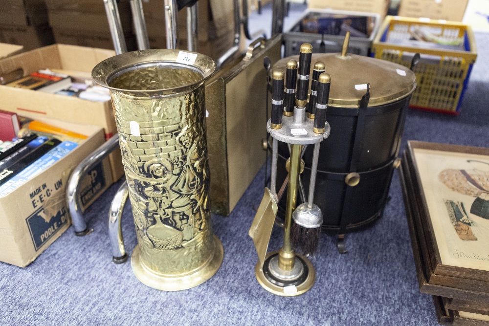 A BRASS UMBRELLA STAND, WITH REPOUSSE DECORATION, A BRASS MAGAZINE RACK WITH SAILING BOAT,