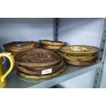 A COLLECTION OF 12 WOODEN CARVED WALL PLATES