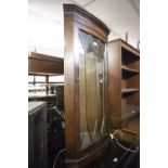 A MAHOGANY MURAL WALL CUPBOARD WITH ASTRAGAL GLAZED DOOR, SLIGHTLY BOWED FRONT