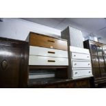 A TEAK AND WHITE FINISH CHEST OF THREE LONG DRAWERS; A WHITE MELAMINE CHEST OF THREE LONG DRAWERS