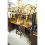 A SET OF FOUR HARDWOOD HOOP-BACK WINDSOR DINING ARMCHAIRS WITH PANEL SEATS AND A PAIR OF WHEEL