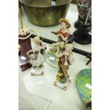 A PAIR OF CAPO DI MONTE CHINA FIGURES BOY AND GIRL EACH STANDING ON ONE LEG, 7 ½" HIGH AND ANOTHER