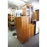 A MATCHING TALL CHEST OF SIX DRAWERS AND A TALL NARROW LIBRARY BOOKCASE (2)