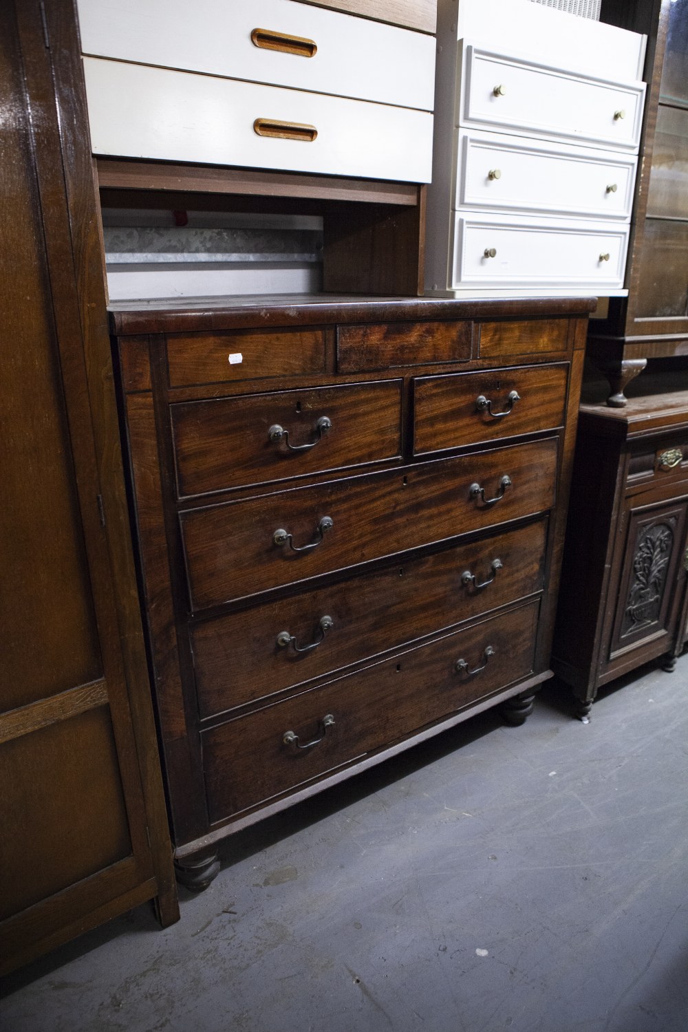 EARLY NINETEENTH CENTURY LARGE CHEST OF TWO SHORT AND THREE LONG DRAWERS ON LATER TURNED FEET, 4'