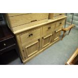 MODERN PINE SIDEBOARD HAVING THREE DRAWERS ABOVE THREE CUPBOARD DOORS