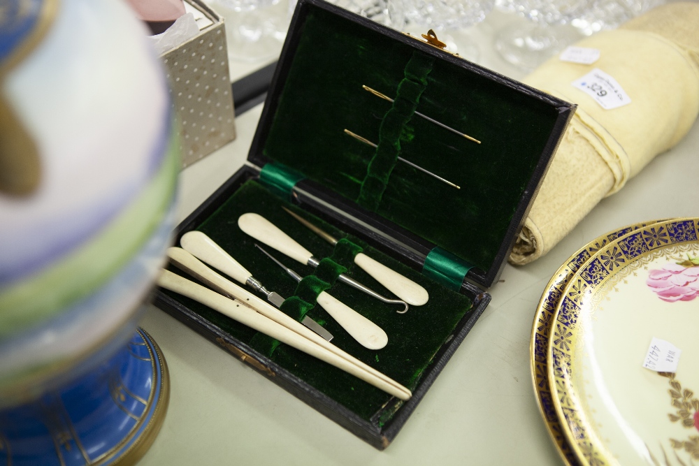 A SEWING SET, HAVING BONE HANDLES, INCLUDING; GLOVE STRETCHERS, BUTTON HOOKS ETC.... (IN FITTED