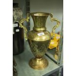 A LARGE BRONZE VASE, DETAIL THROUGHOUT, FLARED RIM AND DOUBLE HANDLES