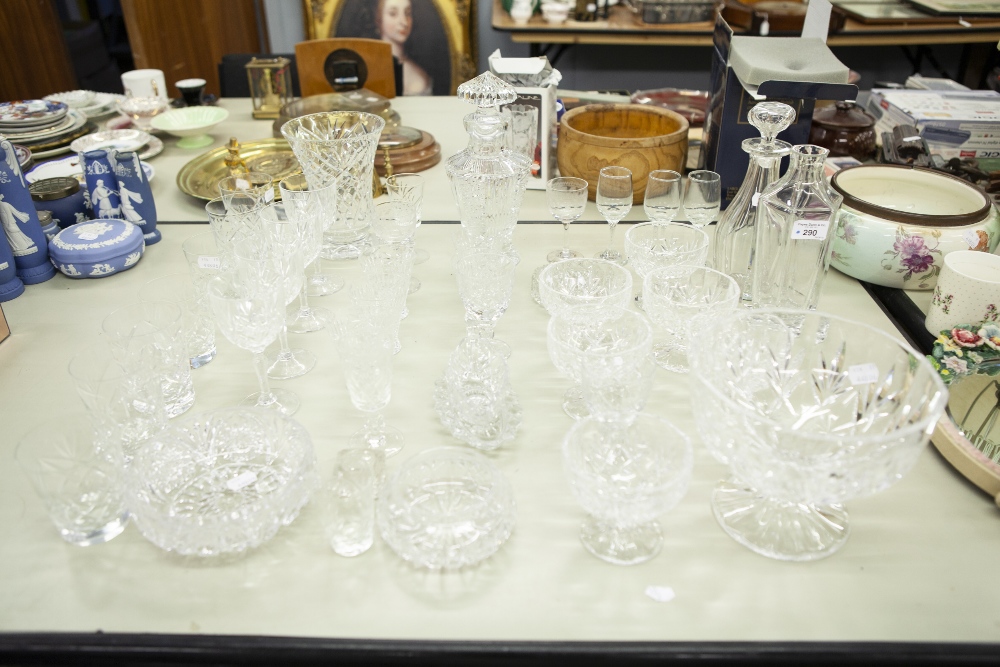 A COLLECTION OF CUT GLASS AND CRYSTAL GLASSES, VASES, DECANTERS, GRAPEFRUIT BOWLS ETC.....