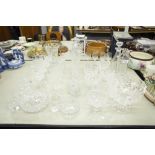 A COLLECTION OF CUT GLASS AND CRYSTAL GLASSES, VASES, DECANTERS, GRAPEFRUIT BOWLS ETC.....