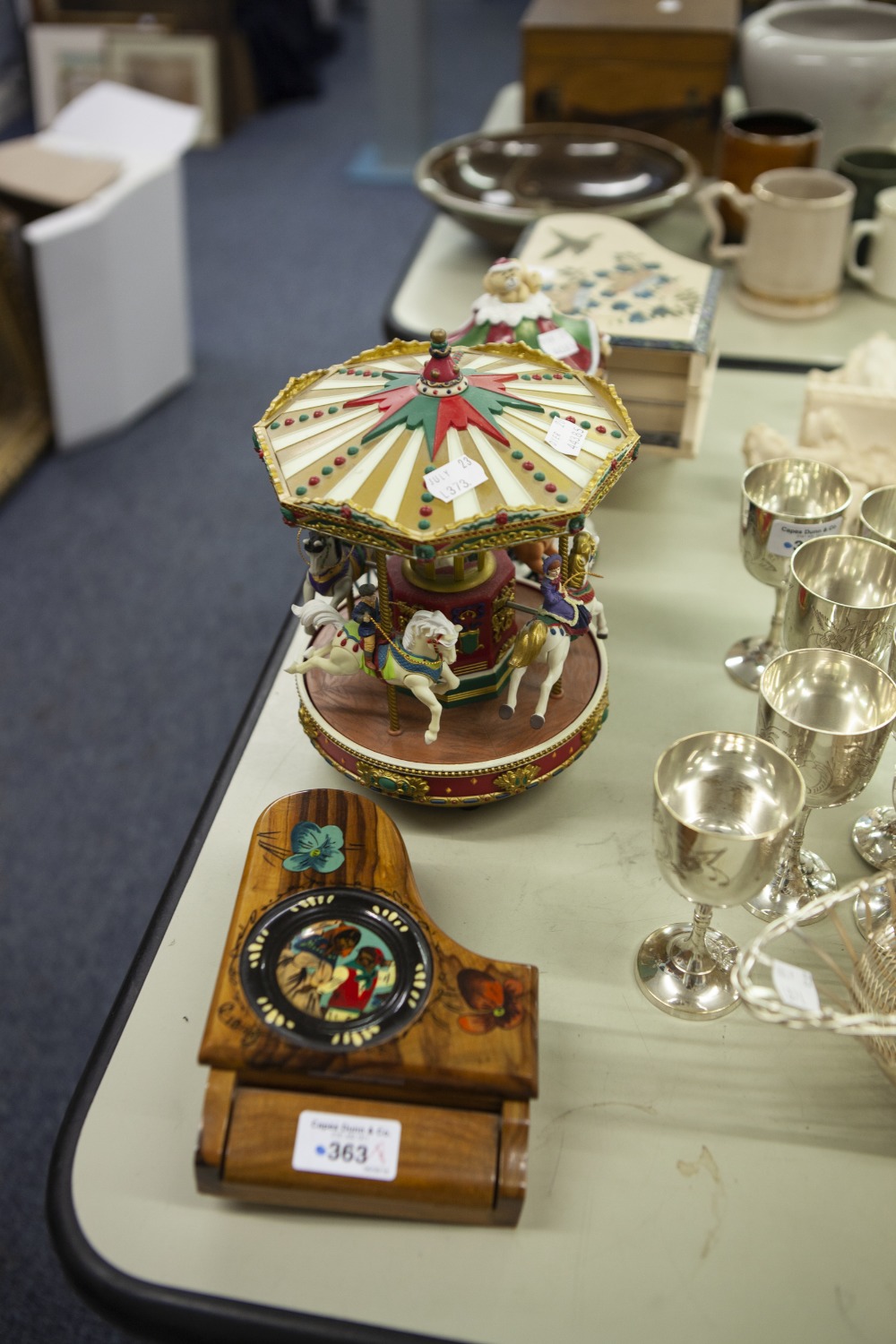 A CONTINENTAL WALNUTWOOD MUSICAL BOX IN THE FORM OF A GRAND PIANO, TWO RESIN ROUNDABOUT PATTERN