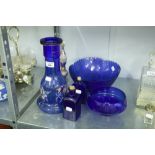 A COLLECTION OF BLUE GLASS TO INCLUDE; A BOTTLE WITH PAINTED DECORATION, BOWLS AND BOTTLES