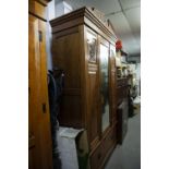 A VICTORIAN WALNUT MIRROR DOOR WARDROBE WITH DRAWER BELOW