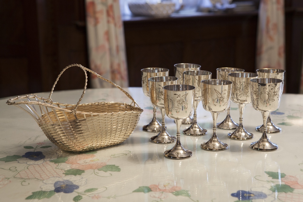 A SET OF 10 ENGRAVED WINE GOBLETS WITH CUP SHAPED BOWLS, EACH ON A WAISTED STEM AND CIRCULAR FOOT,