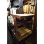 A NEST OF THREE TEAK COFFEE TABLES WITH BEATEN COPPER TOPS