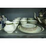 A ROYAL DOULTON 'CLARENDON' TEA SERVICE FOR SIX PERSONS, 22 PIECES