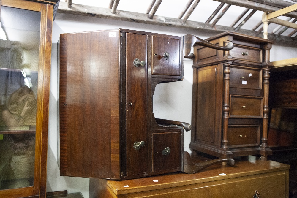 A REPRODUCTION MAHOGANY BUREAU OF SLOPING FALL FRONT, ENCLOSING FITTED COMPARTMENTS OVER ONE LONG