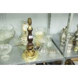 A TABLE LAMP WITH WOODEN AND BRASS STAND, AN ANNIVERSARY CLOCK WITH GLASS DOME, A GLASS BOWL AND