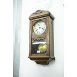 A MAHOGANY WELLINGTON TYPE WALL CLOCK