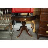 REGENCY STYLE CIRCULAR DINING TABLE WITH DRAWERS ON QUADRANT BASE WITH BRASS CASTORS