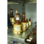 TWO BELLS OLD SCOTCH WHISKEY 6 2/3 fl oz CONTAINERS AND TWO SMALLER (smaller lacking stoppers( (4)