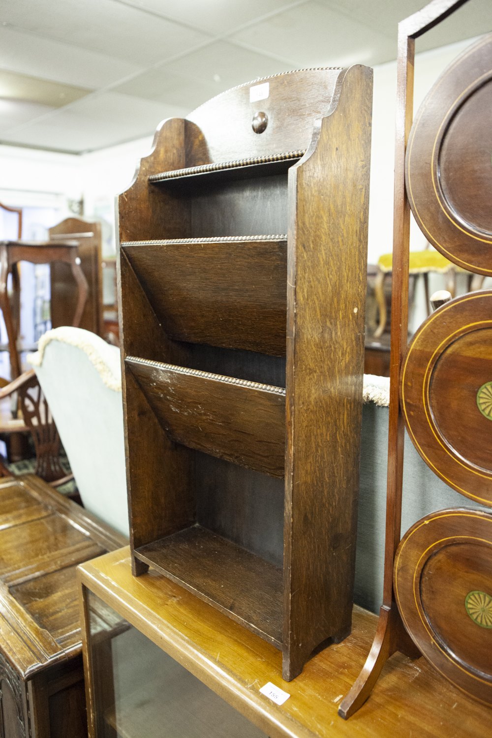 AN OAK THREE SECTION PERIODICAL RACK