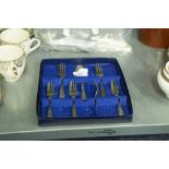 A SET OF SHEFFIELD SILVER PLATE CAKE FORKS AND A SERVER, FOR SIX PERSONS, AND A COLLECTION OF SILVER