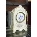 DECORATIVE PORCELAIN MANTEL CLOCK DECORATED IN FLORAL DESIGN