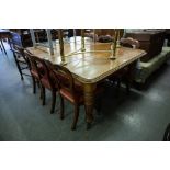 A LATE VICTORIAN OAK OBLONG EXTENDING DINING TABLE WITH TURNED AND FLUTED SUPPORTS, ORIGINAL CERAMIC