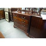 A GEORGE III SMALL MAHOGANY CHEST OF TWO SHORT AND THREE LONG DRAWERS WITH REPLACED CAST BRASS