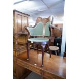 AN EDWARDIAN INLAID MAHOGANY TUB CHAIR ON CABRIOLE FORELEGS (IN THE ART NOUVEAU TASTE)