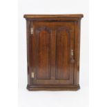 LATE EIGHTEENTH CENTURY OAK CORNER FLAT FRONTED CUPBOARD, the moulded cornice above a single twin