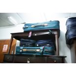 A PAIR OF CLUB HOUSE GREEN CANVAS AND LEATHER TRIMMED SUITCASES AND TWO SMALL CABIN BAGS WITH STRAPS