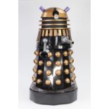 BLACK AND GOLD PAINTED FIBREGLASS MODEL OF A DALEK, with plastic, white metal and mesh detail and