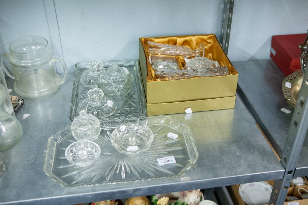 A BOXED CUT GLASS SET INCLUDING; VASES, TRINKET BOX AND COVER AND TWO DRESSING TABLE SETS