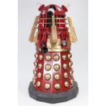 RED AND GOLD PAINTED MANUFACTURED BOARD AND FIBREGLASS MODEL OF A DALEK, with plastic, white metal