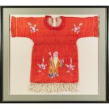 CHINESE EMBROIDERED SILK CHILD'S RED DRESS, worked in coloured threads with a sage and flowers,