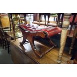 A REPRODUCTION SEAT/STOOL WITH BUTTON RED LEATHER TOP, ON 'X' SUPPORTS