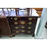 A SMALL GEORGE III MAHOGANY CHEST OF TWO SHORT AND THREE LONG DRAWERS WITH REPLACED PIERCED BRASS