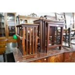 A MODERN NEST OF FOUR TABLES, HAVING BRASS INLAY AND CARVED EDGE, AND MATCHING MAGAZINE STAND/TABLE