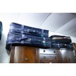 A SET OF THREE CARLTON SUITCASES AND A BLACK CABIN BAG (4)