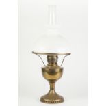 BRASS AND WHITE GLASS OIL TABLE LAMP, of typical form with domed shade and clear glass chimney,