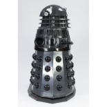 GREY AND BLACK PAINTED MANUFACTURED BOARD AND FIBREGLASS MODEL OF A DALEK, with plastic, white metal
