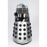 SILVER AND BLACK PAINTED MANUFACTURED BOARD AND FIBREGLASS MODEL OF A DALEK, with plastic and