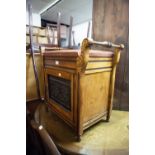 AN EARLY NINETEENTH CENTURY PIANO STOOL AND PAD/SEAT, HANDLE TO EITHER SIDE WITH CUPBOARD BELOW,