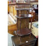 A SMALL MODERN MAHOGANY OVAL THREE TIER WHAT-NOT AND A 1960's KIDNEY SHAPED COFFEE TABLE ON TV LEGS