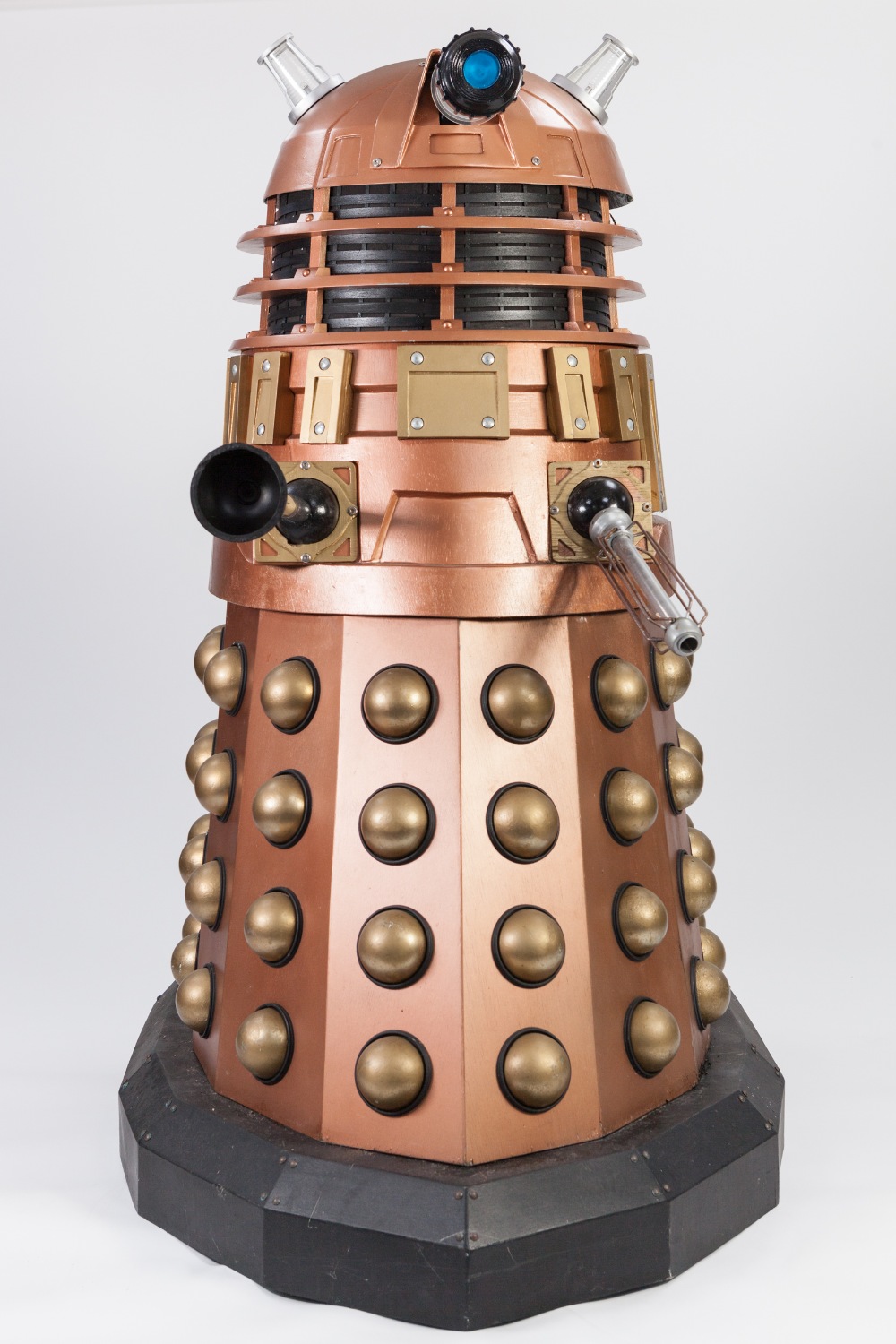COPPER AND GOLD PAINTED MANUFACTURED BOARD AND FIBREGLASS MODEL OF A DALEK, with internal seat and