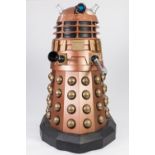 COPPER AND GOLD PAINTED MANUFACTURED BOARD AND FIBREGLASS MODEL OF A DALEK, with internal seat and