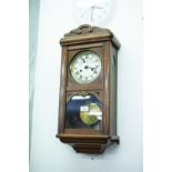 A MAHOGANY WELLINGTON TYPE WALL CLOCK